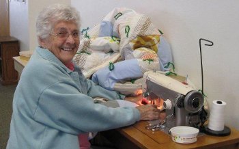 At the sewing machine